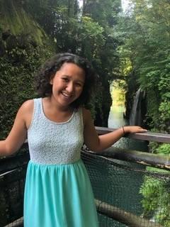 Angel Bista in front of waterfall